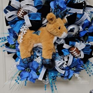 Carolina Panther Blue and Black Christmas Sports Wreath with Plush Reindeer.